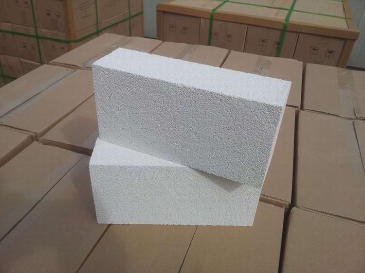 Insulating refractory brick