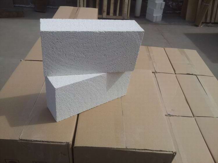 Insulating refractory brick