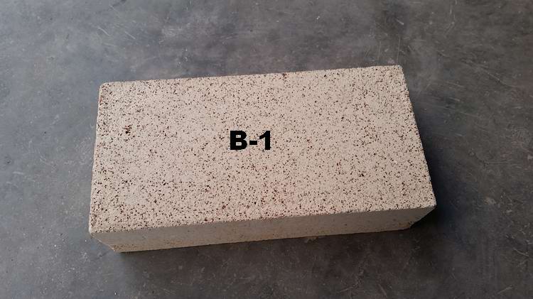 Insulating refractory brick