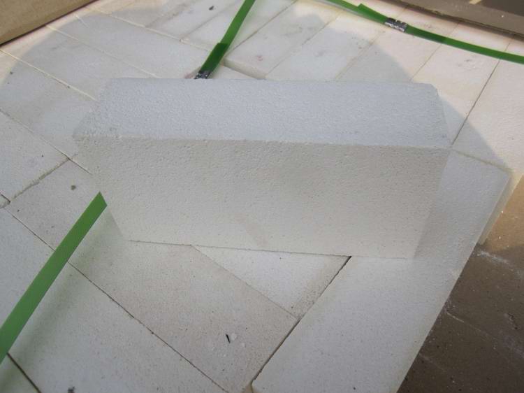 Insulating refractory brick