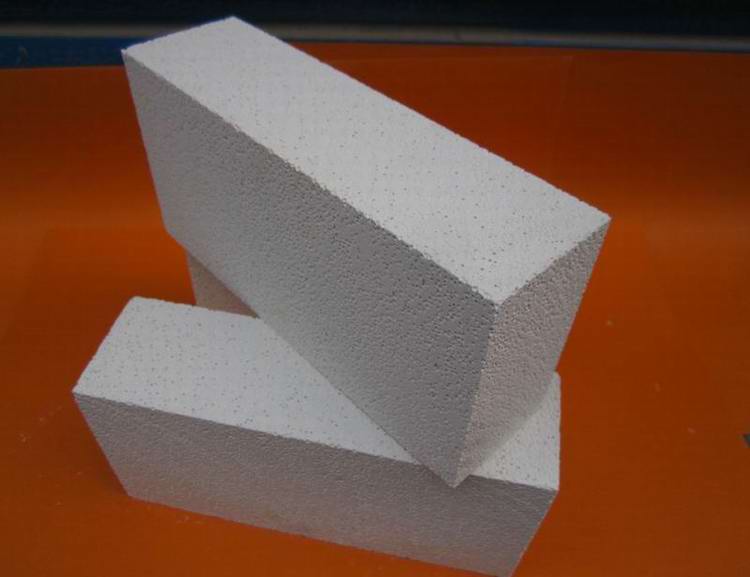 Insulating refractory brick